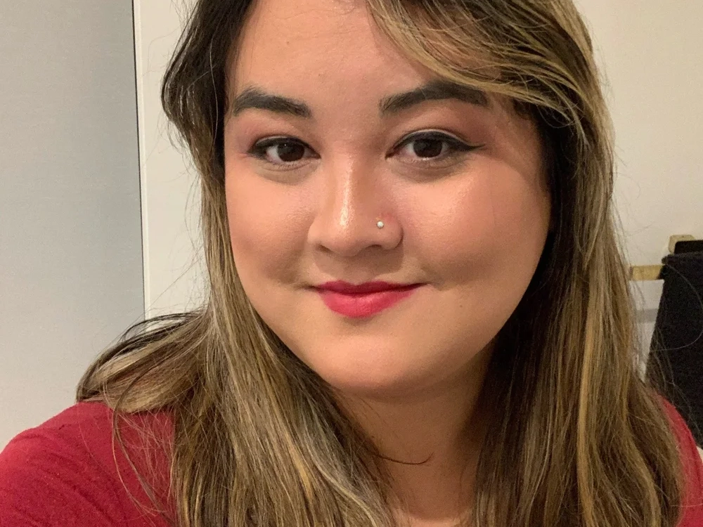 Evelyn, Interim Chair, smiling in a headshot